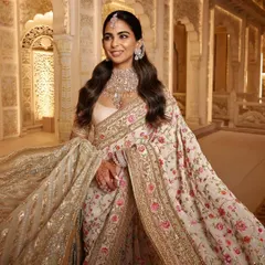 Another beautiful shot of the 'Garden of Love' look, highlighting the delicate floral patterns and the elegant drape of the saree. This is a great example of classic yet contemporary ethnic wear styling.