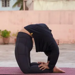 Working towards Kapotasana, or Pigeon Pose. This is a deep backbend that requires open shoulders and hip flexors. I guide students through preparatory poses to make advanced postures like this more accessible.