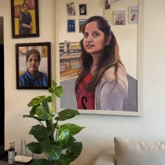 The final destination for my art. This large-scale custom acrylic portrait is shown hanging in my client's living room, demonstrating how a painting can transform a space.