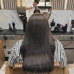And this is the stunning 'after'. Our Hair Botox treatment has completely revitalized the hair, leaving it sleek, smooth, and full of healthy shine from root to tip.