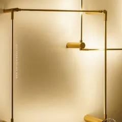A closer look at our minimalist square LED wall sconces. The slim gold-finished frame emits a soft backlight, creating a halo effect on the wall. These can be arranged in overlapping patterns for a custom art installation.