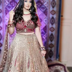 A full view of the Marwari-style lehenga, showing the contrast between the red blouse and the gold skirt. The entire look is available for rent at my Delhi studio.