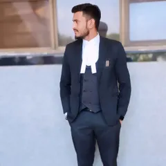 A professional portrait in a three-piece suit and advocate's band. This is the uniform of my profession, and I wear it with pride.