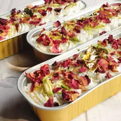 To celebrate Eid, I offer these stunning Rose and Pistachio Tres Leches Boats. The dessert combines delicate rose petals, crunchy pistachios, and creamy tres leches, finished with edible gold leaf for a touch of luxury.