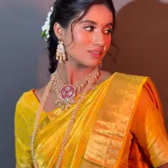 Your Haldi look should be fresh, vibrant, and joyful. For this client, I created a luminous look with a pop of color on the eyes that complemented her beautiful yellow saree, ensuring she looked radiant for this special pre-wedding ceremony.