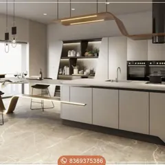 The epitome of modern luxury, this kitchen features a massive island that doubles as a dining area. The minimalist, handleless cabinetry and state-of-the-art integrated appliances create a seamless and sophisticated architectural statement.