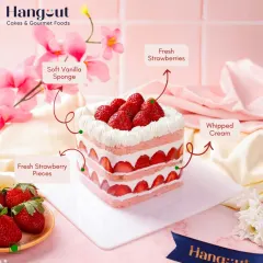 This is our Fresh Strawberry Cake, deconstructed. You can see the layers of soft vanilla sponge, light whipped cream, and generous pieces of fresh, seasonal strawberries. We believe in using high quality ingredients you can see and taste.