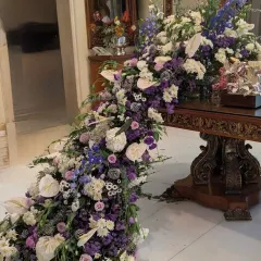 To elevate a dining space, I created this dramatic flower trail cascading from the table to the floor. The mix of purples, blues, and whites creates a sense of movement and luxury, turning the entire room into a floral wonderland.