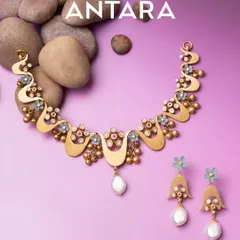 Light in weight, heavy on impact. This 22KT matte gold necklace and earring set is inspired by blooming waves and wildflowers, blending textures and pearls into wearable art that feels bold yet comfortable.