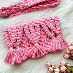 A playful and feminine design, this pink sling bag features beautiful cascading tassels, each accented with a small bead for a touch of sparkle.