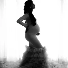 Another angle from this beautiful silhouette session. The high-contrast black and white effect creates a dramatic and artistic feel.