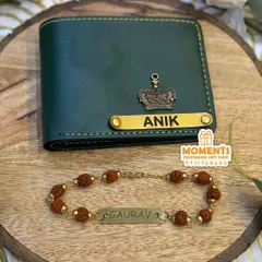 This combo includes a personalized men's wallet and a Rudraksha rakhi with a name. The wallet is available in multiple colors and can be customized with a name and a charm, like the crown shown here.