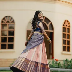 A happy twirl from bride Brunda in her custom half saree. The movement of the pleated Kanjivaram skirt is just beautiful.