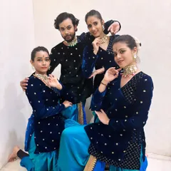 Our full dance troupe in our matching blue and turquoise semi-classical costumes. Posing together before a show, you can feel the camaraderie and shared passion for our art.