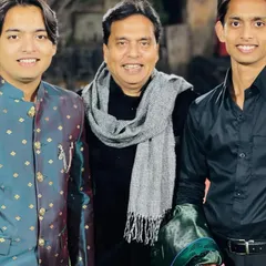 With my father and brother. My family is the foundation of my music and my life. Happy birthday, Abbu.