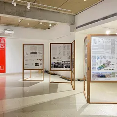 The "Small is beautiful - a billion stories" exhibition, designed for the London Design Biennale and later shown in India. The design uses modular display panels and focused lighting to present complex ideas in an accessible and engaging format.