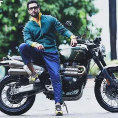 This edgy, sporty look on Vicky Kaushal, featuring a spiked green and yellow jacket, was for a magazine shoot. It shows how versatile styling can be, moving from classic to contemporary with ease.