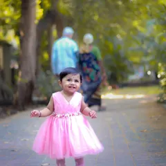 A beautiful moment during a multi-generational family shoot. Here, a little one explores the park while her grandparents watch on, creating a timeless family portrait.