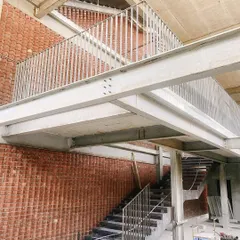 The steel framework of a staircase and mezzanine at the Play Arena project. This highlights my studio's expertise in steel buildings and creating layered, multi-level spaces.