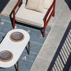 An overhead view of the expansive deck at the Max128 apartment. This space was designed as an urban oasis, blurring the line between indoor comfort and outdoor living.