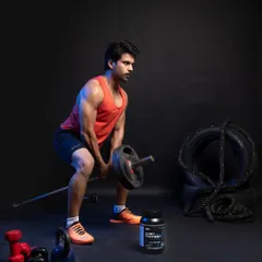 A male fitness model performing a deadlift, with the whey protein container strategically placed in the foreground to associate the product with strength and performance.