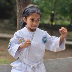 The focus in her eyes says it all. We teach our young students the correct stance and form from day one, building a solid foundation for their martial arts journey.