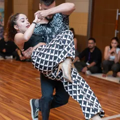 An action shot from the Kizomba competition, showcasing a dynamic lift and the athletic skill of our performers. Our training prepares dancers for high level performances.
