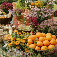 A close-up of a personalized Mehendi grazing table, where fresh fruits and flowers are integrated into the food display. Every detail is an opportunity for artistry and personal storytelling.