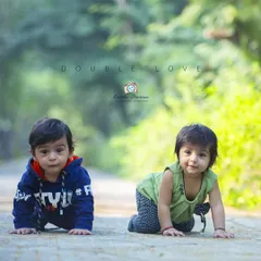 Capturing two little ones on the move. This photo of twin babies crawling side by side on a park path is a perfect example of the candid, action-filled moments I love to document.