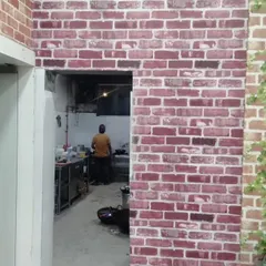 Another view of the red brick wallpaper in the commercial space.
