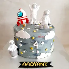 Aadyant is fascinated with space, and for the last two years, I've made him a space-themed cake. This minimal-fondant version features non-edible astronaut toys that he can play with later.