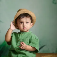 A curious expression captured in the studio. Indoor sessions allow for beautifully controlled lighting that really makes your child's features and personality shine.