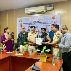 Receiving a certificate of appreciation from the Assistant Commissioner of Police, Mr. Arvind, during a Women Safety workshop organized at the Indira Gandhi Institute of Physical Education & Sports Sciences.
