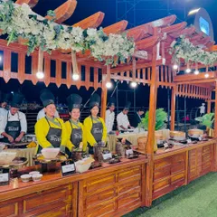 A wide view of the rustic wooden sushi counter, where my chefs prepare and display a beautiful assortment of sushi.