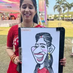 The laughter and joy are what make wedding events so special. This guest was thrilled with her caricature at a vibrant Haldi function in Madhya Pradesh.