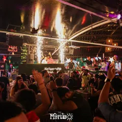 A wide shot of the Christmas celebration at Cafe Mambo, with pyrotechnics going off above the DJ booth. This shows the scale of the holiday events I handle.