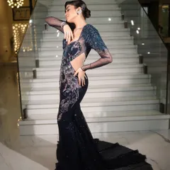 Posing for the camera in a stunning sequined gown. The makeup here was all about creating a luminous, sculpted look that catches the light beautifully. The side profile highlights the clean lines of the hairstyle and the flawless skin finish.