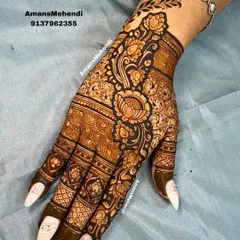 A beautiful floral vine design for the back of the hand. The pattern flows diagonally across the hand, adorned with lotus flowers and delicate leaves, perfect for an elegant look.
