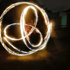 This is a long exposure photo of a fire poi pattern called a triquetra. It shows how you can create beautiful light trails and shapes in the air with precise movements.