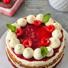 My Fresh Raspberry Tiramisu Cake, a rustic, naked cake featuring layers of light sponge, creamy egg-free tiramisu filling, and a vibrant topping of fresh raspberry compote and whole berries. I never use artificial flavors, just pure indulgence.