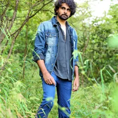 A full-length male portrait from a fashion shoot in a natural, outdoor setting. This kind of work showcases my ability to direct models and use natural light effectively for portraits.