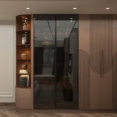 This custom wardrobe features a unique design with routed wave patterns on the doors, combined with a smoked glass panel and a curved, open display shelf.
