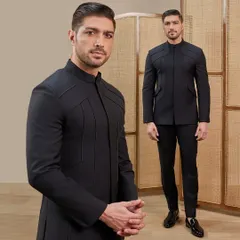This timeless black bandhgala is defined by its sharp lines and endless possibilities. The clean silhouette and subtle shoulder detailing make it a powerful statement of minimalist luxury.