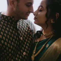 An intimate, moody portrait from an engagement shoot. The close framing and their gentle expressions create a very personal and romantic image, highlighting the deep connection between them.