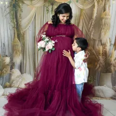 Awaiting the new arrival. This beautiful maternity photo captures a mother and her son sharing a special moment before the family grows.