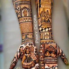 This bridal design is a beautiful mix of personal and traditional art. The palms feature a family portrait and a depiction of the wedding ceremony, while the arms are adorned with swans and architectural elements.
