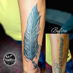 Another successful cover-up. This faded name tattoo was completely hidden by a new, vibrant feather quill design.