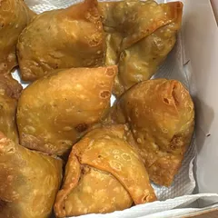 Freshly fried and ready to serve. These crispy, golden-brown samosas are a classic party snack that we make for events and bulk orders. They are perfect with a cup of chai.
