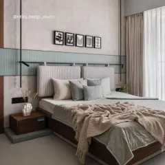 Texture is key in this Japandi-inspired bedroom. The combination of the vertically striped headboard, the soft green fluted paneling, and the rough-textured wall creates a layered, tactile experience. The minimalist black track lighting adds a modern, industrial touch.