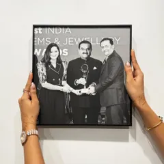 A photograph with industrialist Gautam Adani, framed for the Kiran Gems corporate office. This project showcases our ability to deliver high-volume, high-quality framing for our corporate clients.